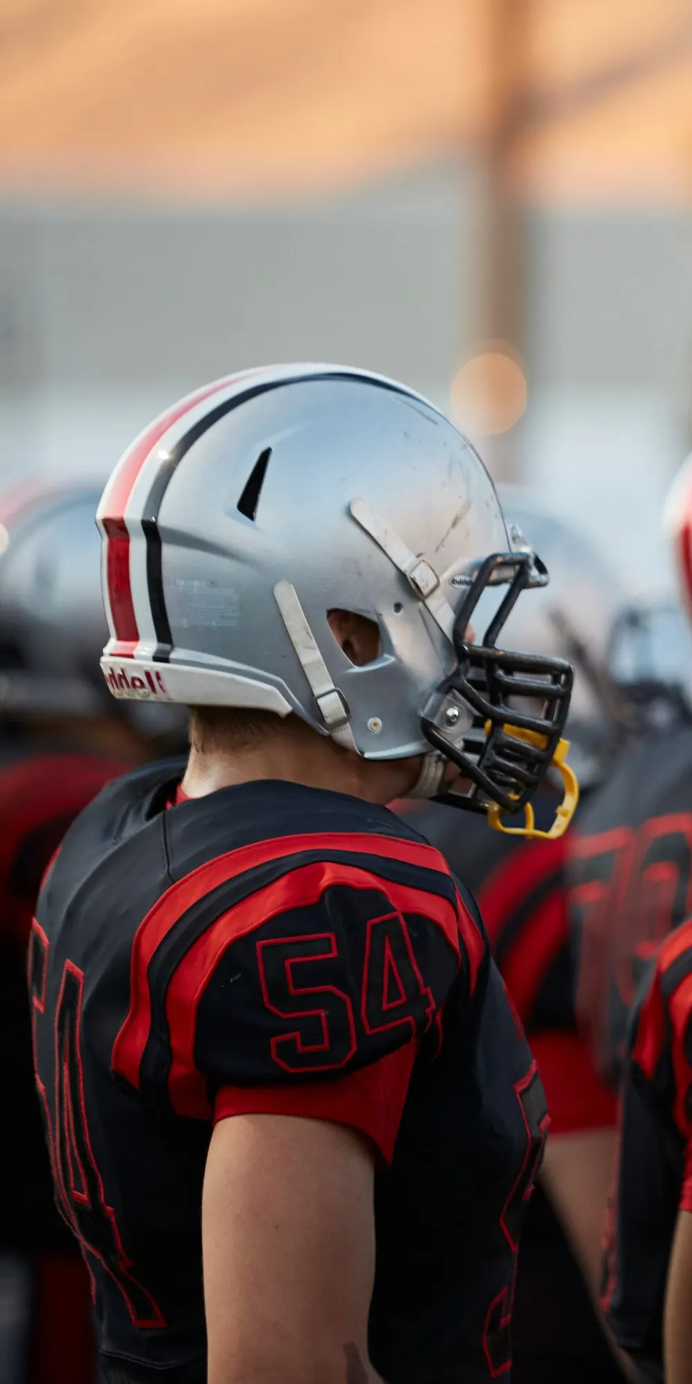 A football team in a huddle before the game