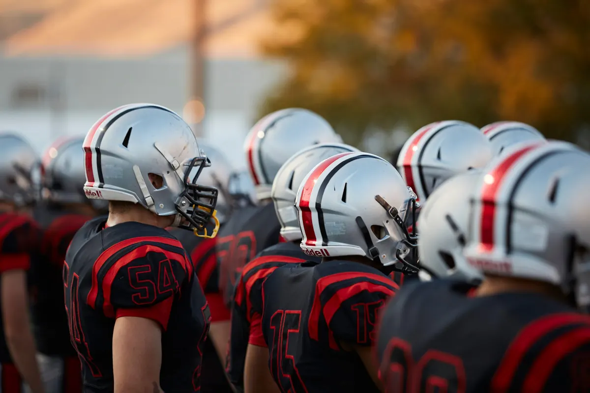 Players in a huddle before kickoff